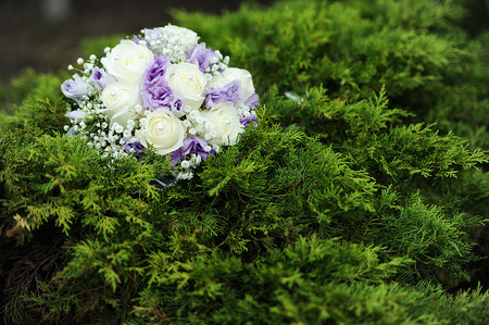 wedding bunch of flowers on a green grassの写真素材