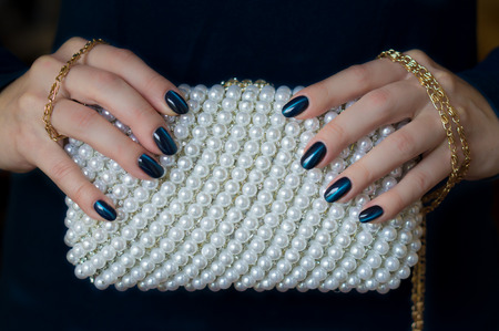 beautiful manicure & pearl clutch bagの写真素材