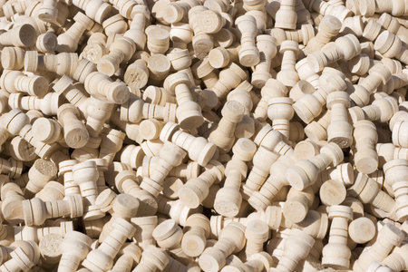 Wooden white chess pieces filling up the frame