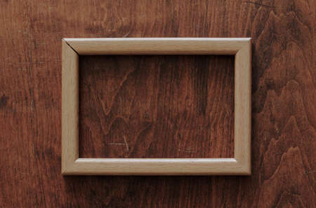 blank frame on old wooden backgroundの写真素材