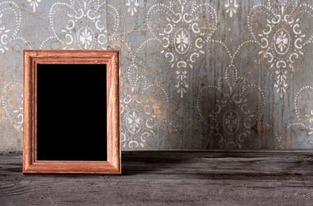 vintage photo-frame on old tableの写真素材