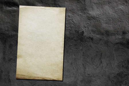 old paper on grey dirty wallの写真素材