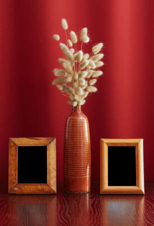 vintage photo-frames and ikebana on tableの写真素材
