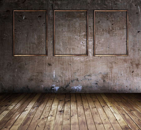 old grunge room with three wooden framesの写真素材