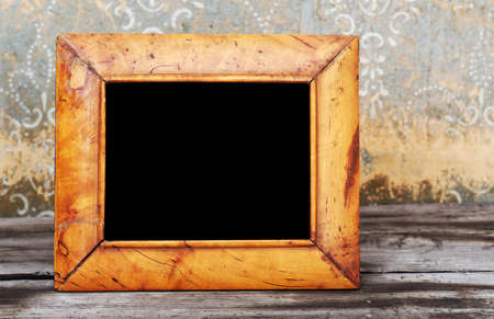 vintage photo-frame on old tableの写真素材