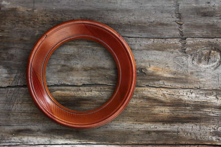 blank frame on old wooden backgroundの写真素材