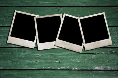 old photos on wooden wallの写真素材