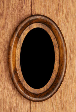 vintage oval photo-frame on wooden backgroundの写真素材