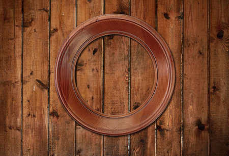 picture frame on old wooden wallの写真素材