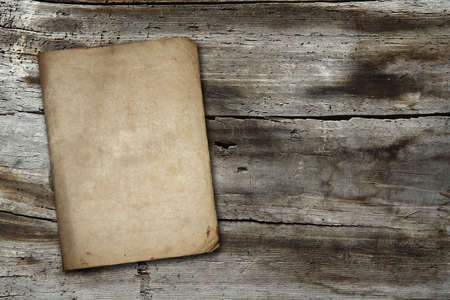 vintage paper on old wood textureの写真素材