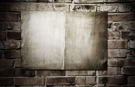 old paper on brickwallの写真素材