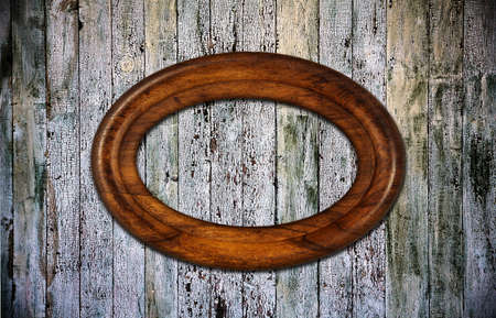 blank photoframe on old wooden backgroundの写真素材