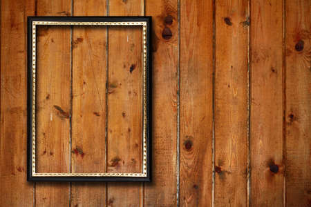 picture frame on old wooden wallの写真素材