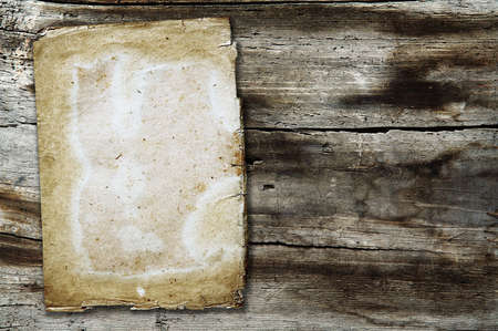 vintage paper on old wood textureの写真素材