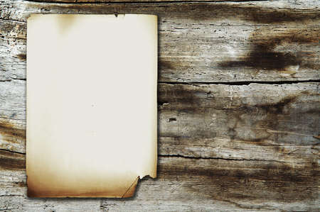 vintage paper on old wood textureの写真素材