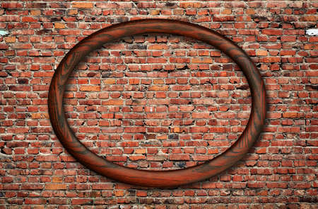 blank photo frame on old brick wallの写真素材