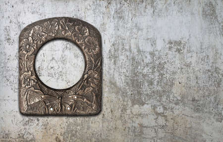 blank photo frame on old wallの写真素材