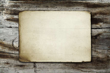 vintage paper on old wood textureの写真素材