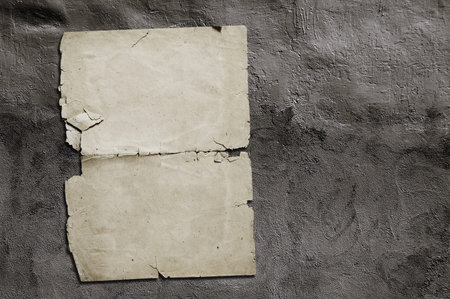old paper on grey dirty wall