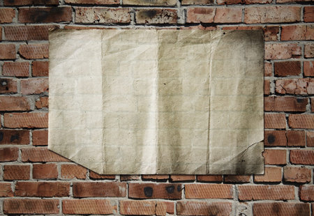 old paper on brickwall