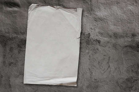 old paper on grey dirty wallの写真素材