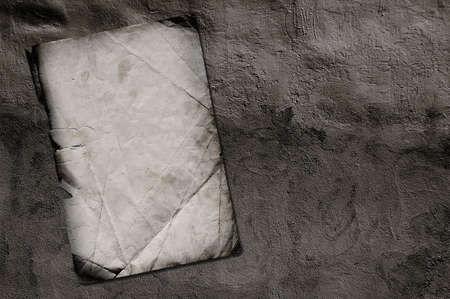 old paper on grey dirty wallの写真素材