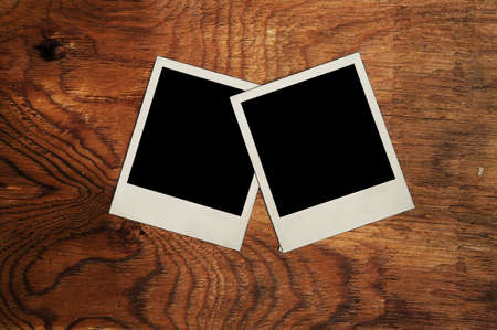old photos on wooden wallの写真素材
