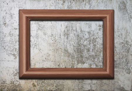 blank photo frame on old wallの写真素材
