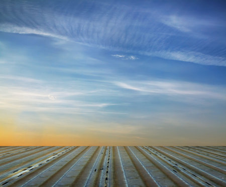 blue sky and metallic floor, industrial background 
