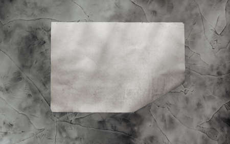 old paper on grey dirty wall の写真素材