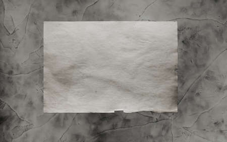 old paper on grey dirty wall の写真素材