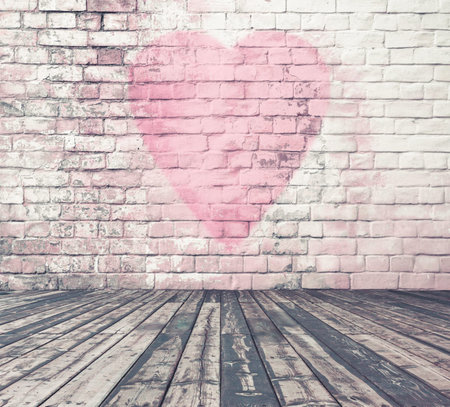 old room with brick wall graffiti heart, valentines day backgroundの写真素材