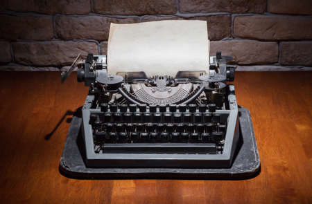 old typewriter on wooden tableの写真素材