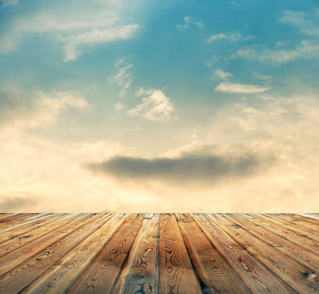 sunset sky and wood floor, filtered background image の写真素材
