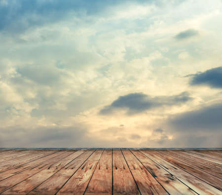 sunset sky and wood floor, filtered background image の写真素材