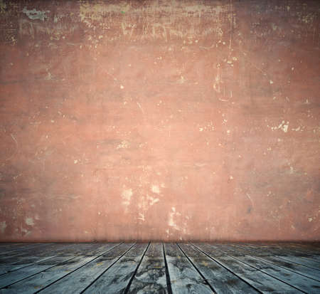 old room with concrete wall and wooden floorの写真素材