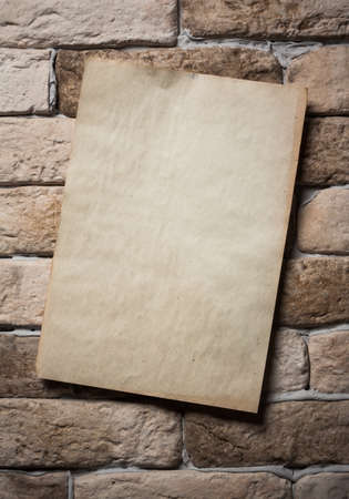 old paper on brick wallの写真素材