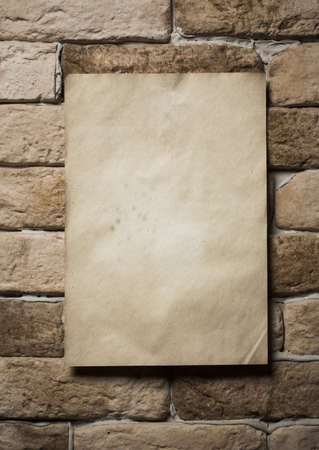 old paper on brick wallの写真素材
