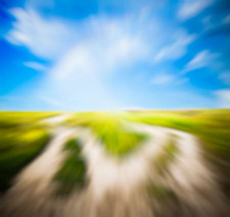 two country road in the fields, with slight motion blurの写真素材