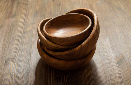 empty wooden bowls on tableの写真素材