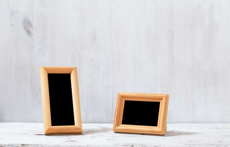 photo frames on old white tableの写真素材