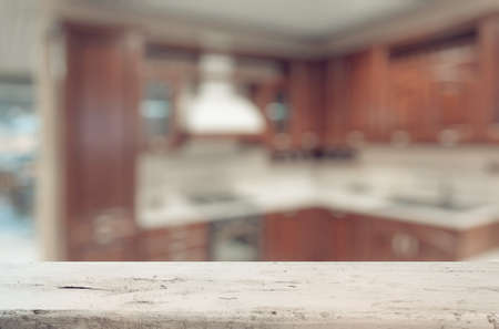 old white wooden table in the kitchenの写真素材