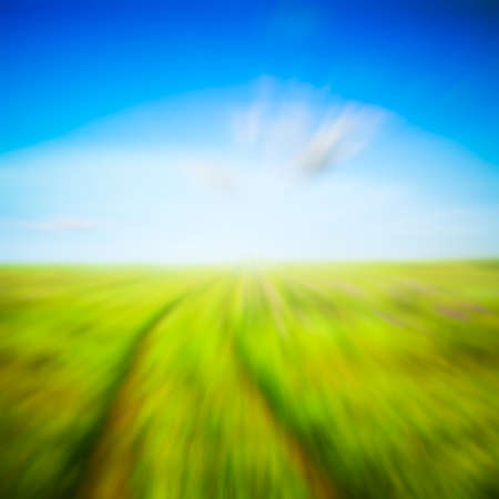 country road in the fields, with slight motion blurの写真素材