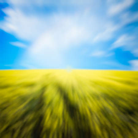 country road in the fields, with slight motion blurの写真素材