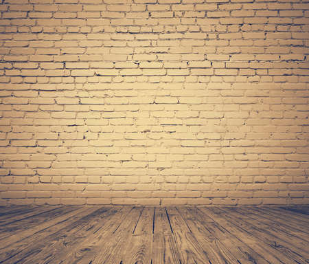 old room with brick wall, vintage background, retro film filteredの写真素材