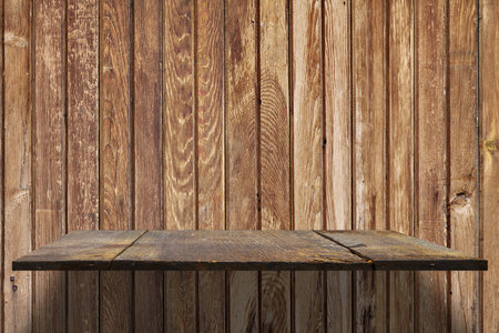 empty shelves on wooden wallの写真素材