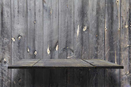 empty shelves on wooden wallの写真素材