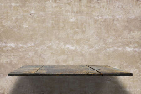 empty shelves on concrete wallの写真素材