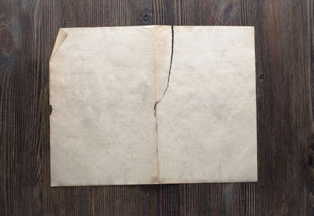 white paper on old wooden backgroundの写真素材