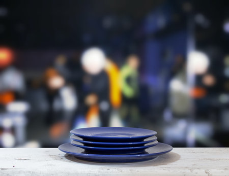 plates on white table in a night club